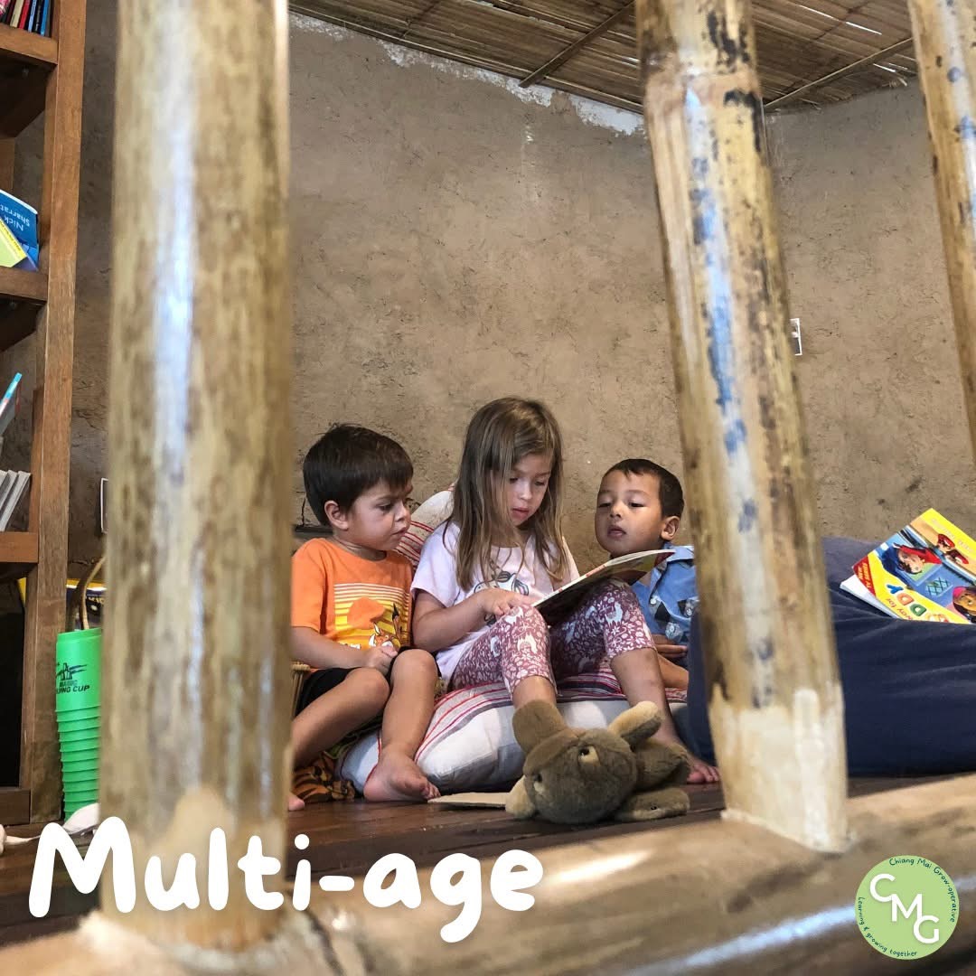 Children reading together at The Mud House play-based preschool in Chiang Mai